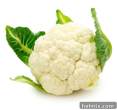Low Carb Vegetables: Your Essential Guide to What to Eat and What to Skip 8 A whole fresh cauliflower isolated on a white background.