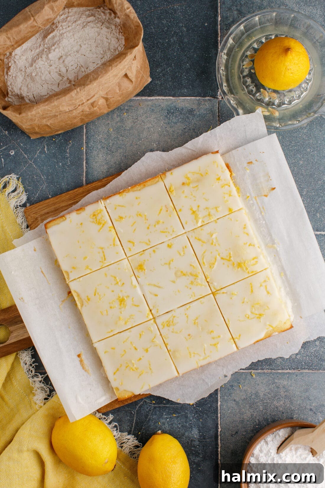 Lemon Brownies cut into squares on a wooden cutting board