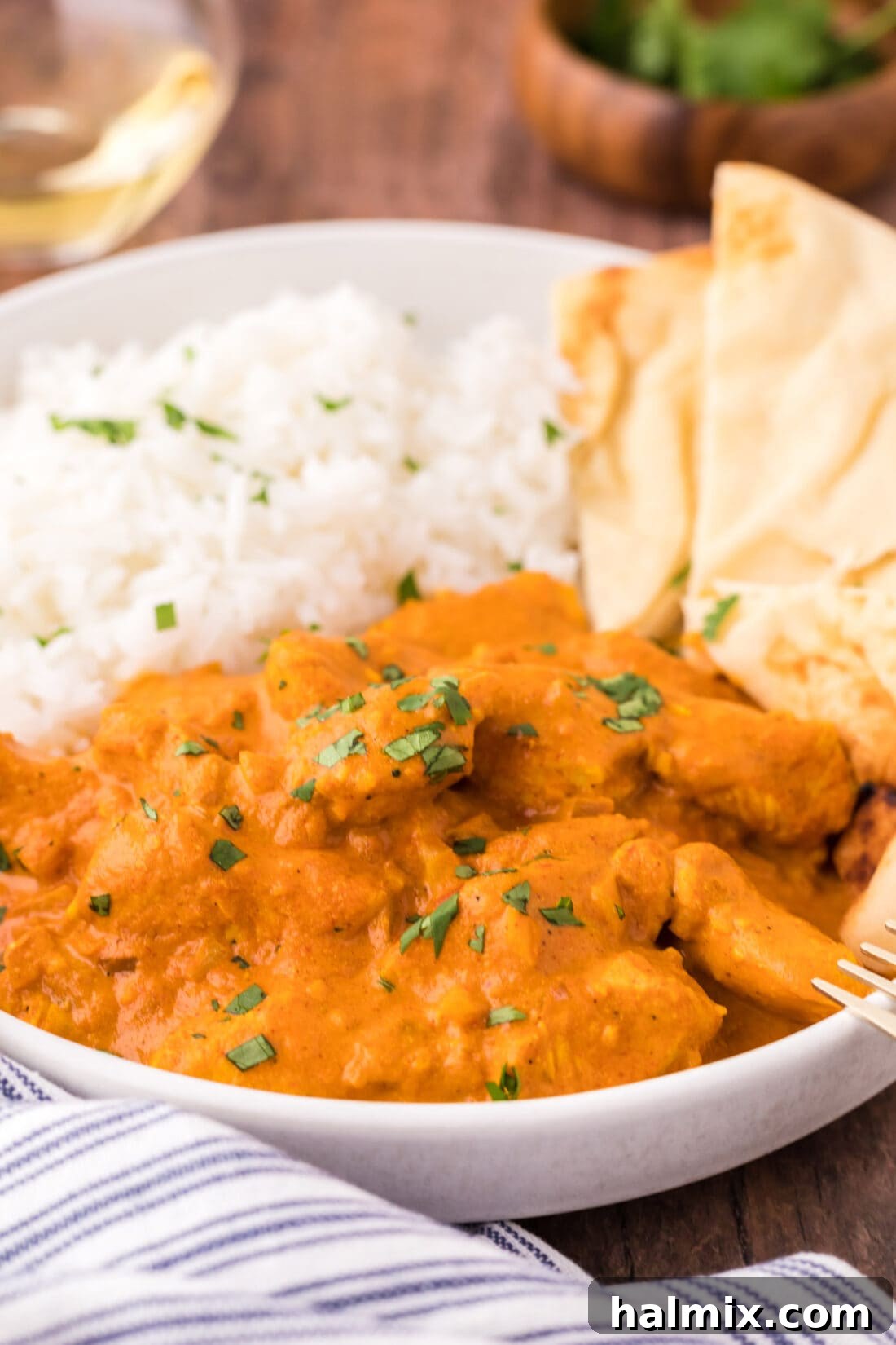 Close up of a bowl of Chicken Tikka Masala with rice