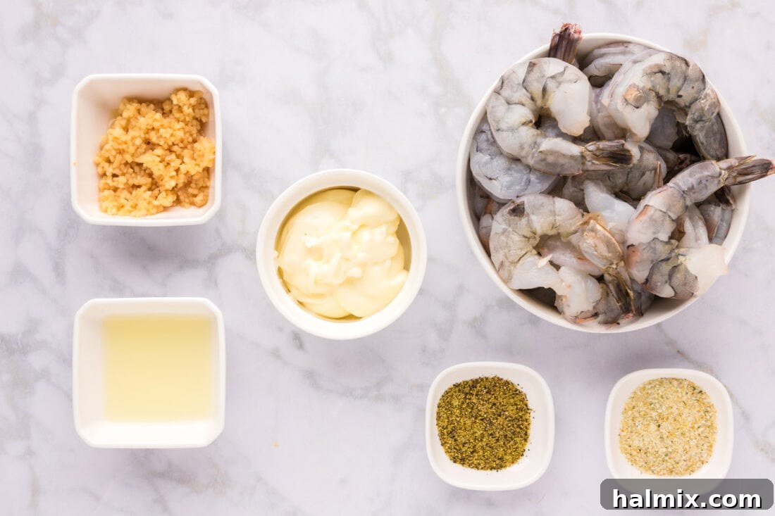Collection of fresh ingredients for Garlic Butter Shrimp laid out on a surface