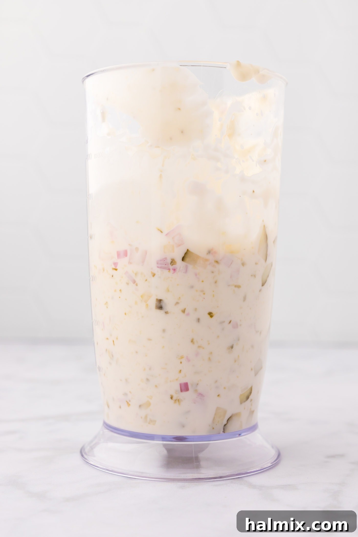 Zest for the Catch 7 Prepared tartar sauce in a mixing container, ready for chilling