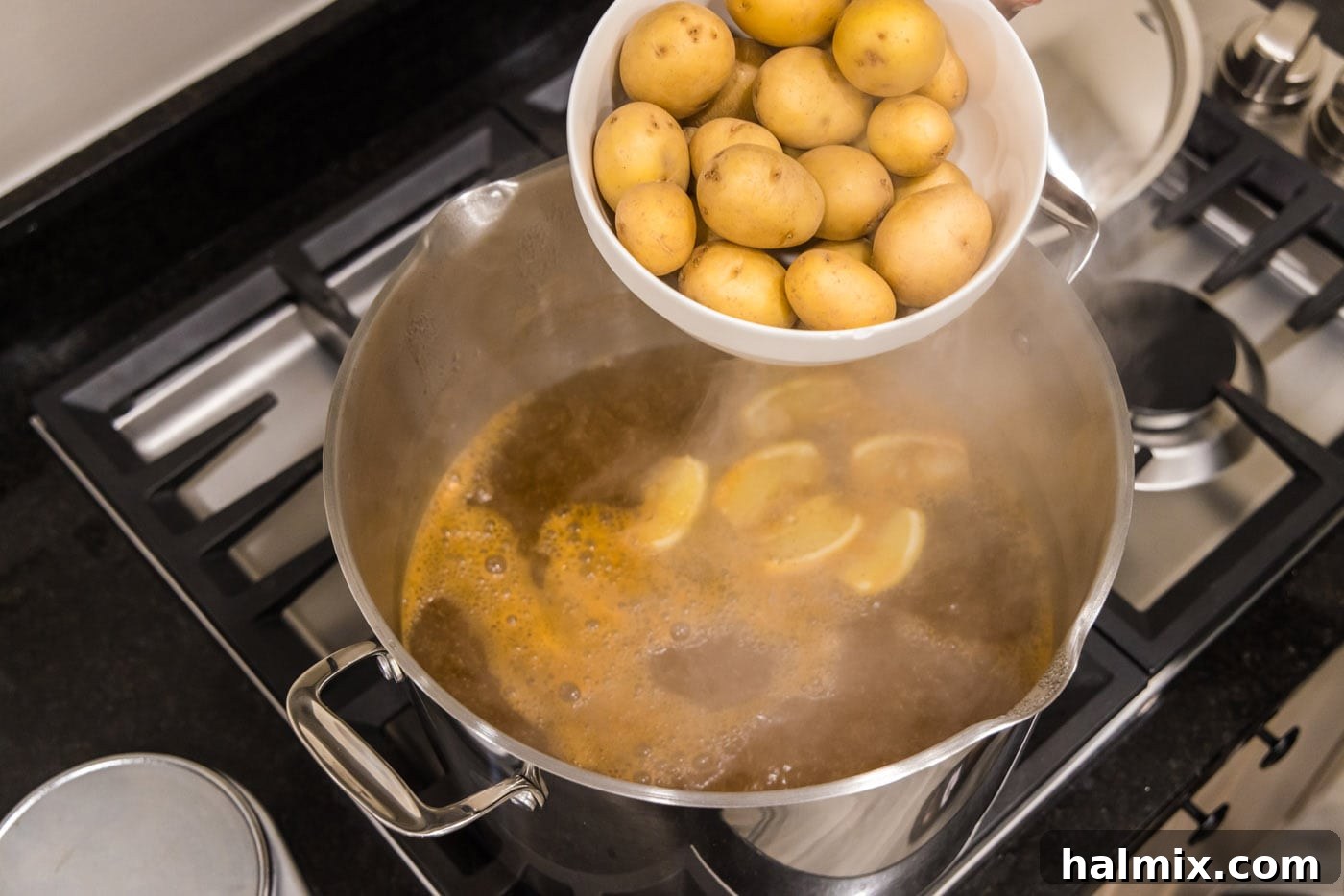 Ocean's Harvest Feast 6 adding yukon gold babay potatoes to a pot of boiling water