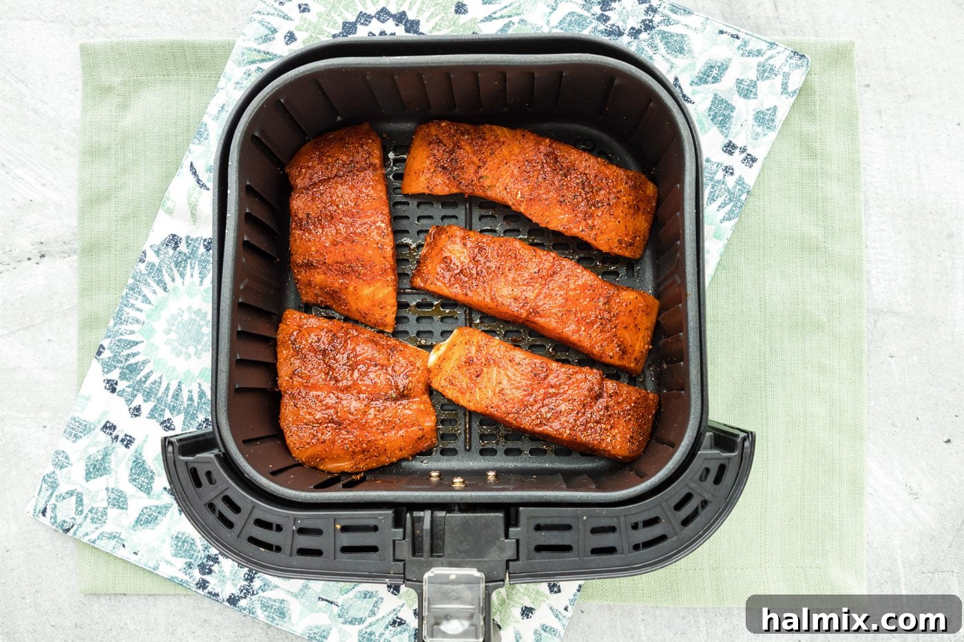salmon filtes in an air fryer basket