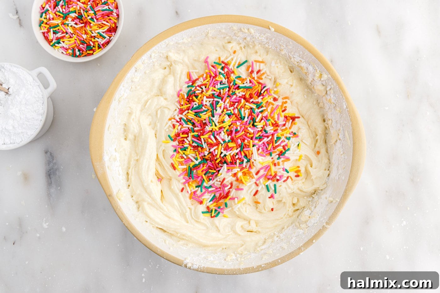 Festive Sprinkle Cake 11 rainbow Jimmies added to cake batter