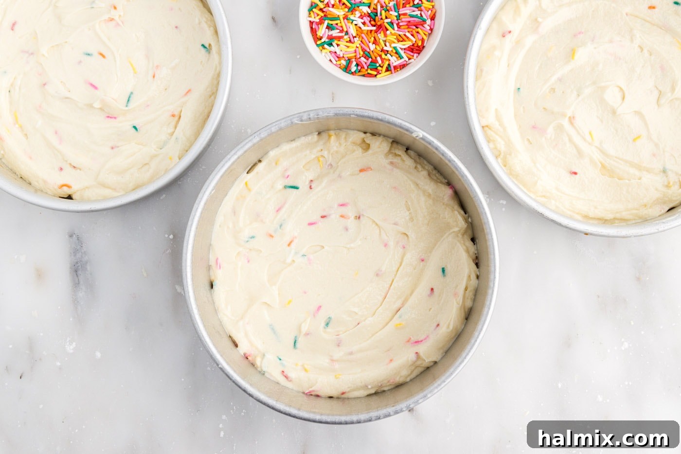 Festive Sprinkle Cake 12 funfetti cake batter in cake pans