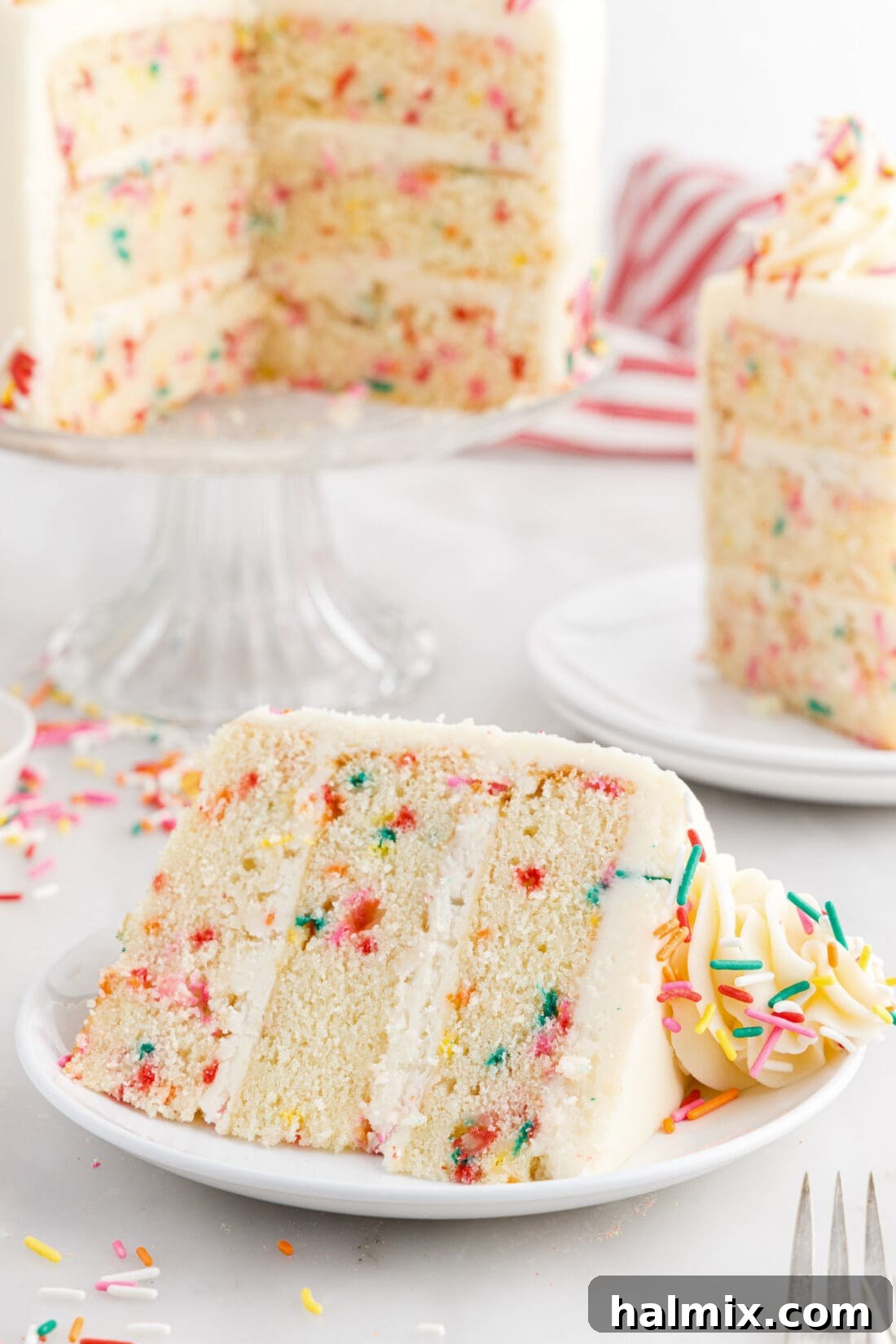 Festive Sprinkle Cake 3 Slice of Funfetti Cake on a plate