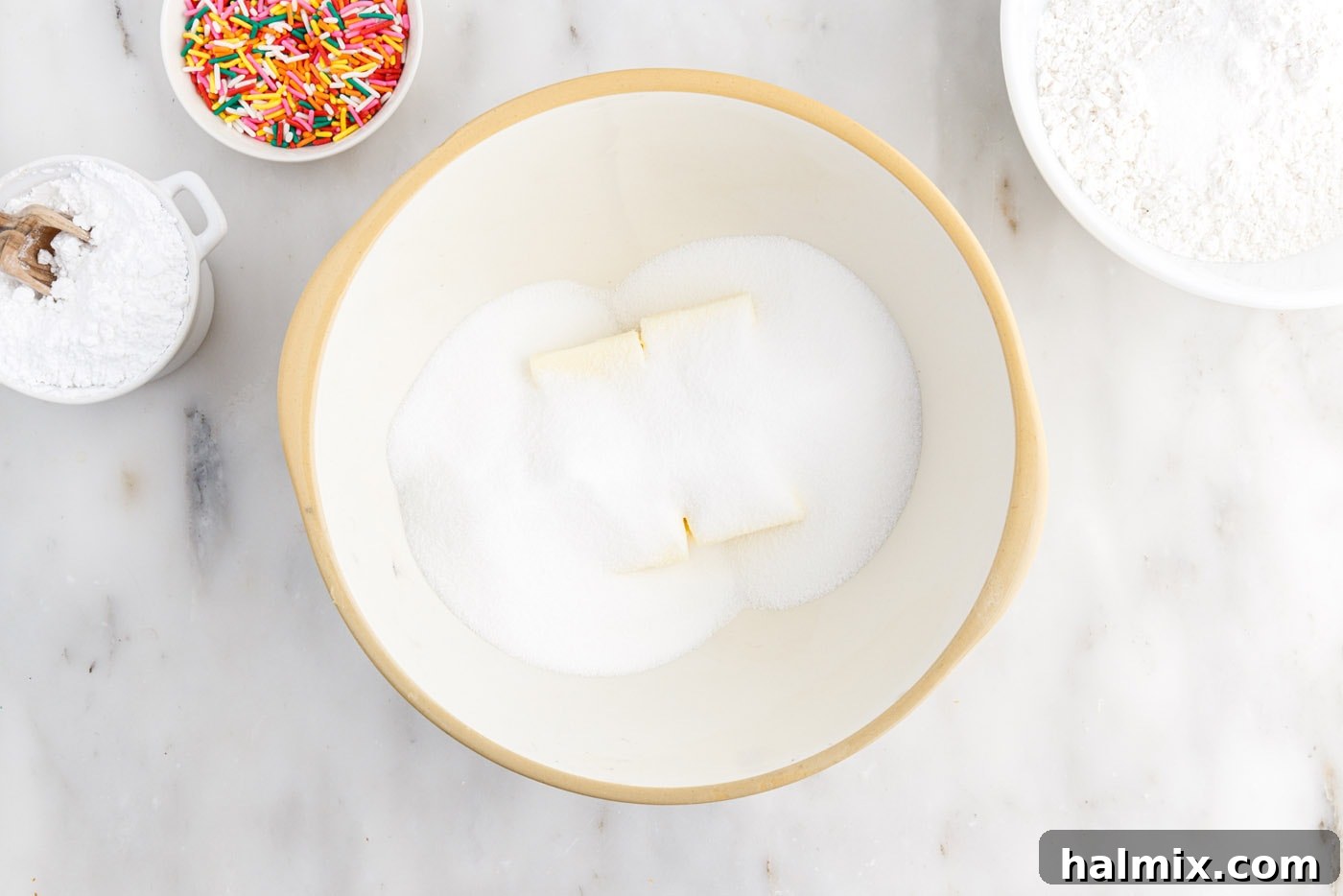 Festive Sprinkle Cake 5 butter and sugar in a mixing bowl