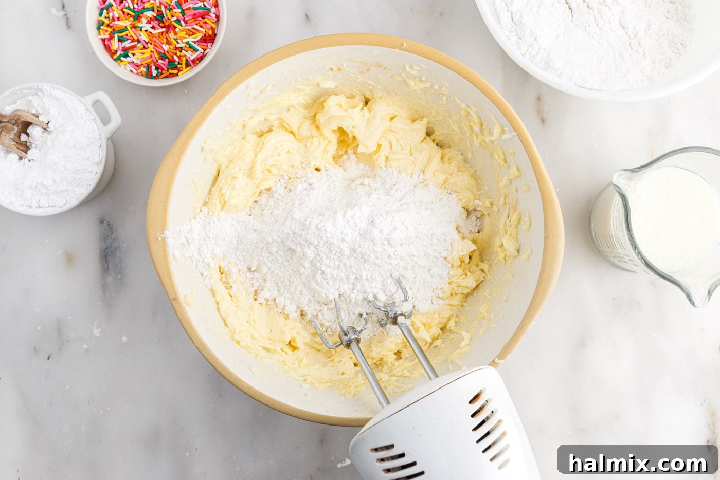 Festive Sprinkle Cake 8 mixing flour mixture into butter mixture