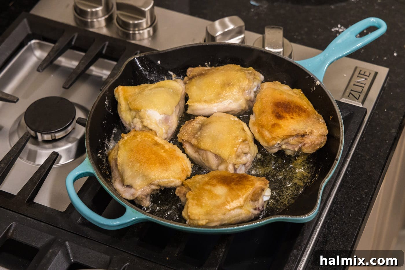 cooking chicken thighs in a skillet