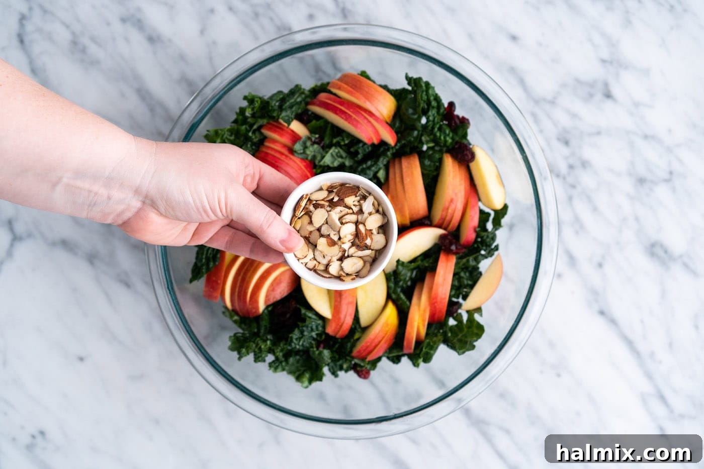 Adding almonds to kale salad