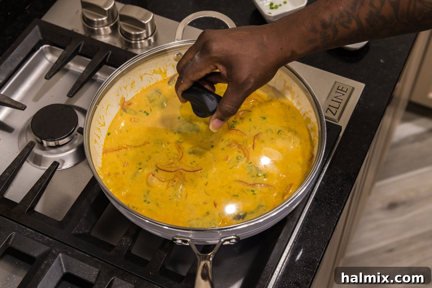 Vibrant Shrimp Curry 11 placing a lid on shrimp curry on the stovetop