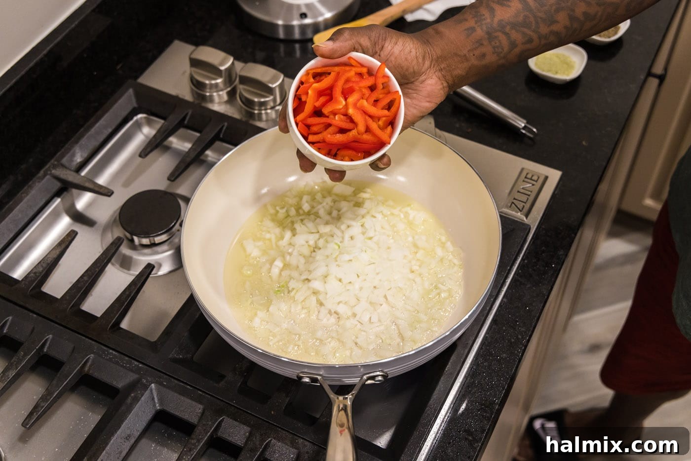 Vibrant Shrimp Curry 5 adding onion and bell pepper to skillet