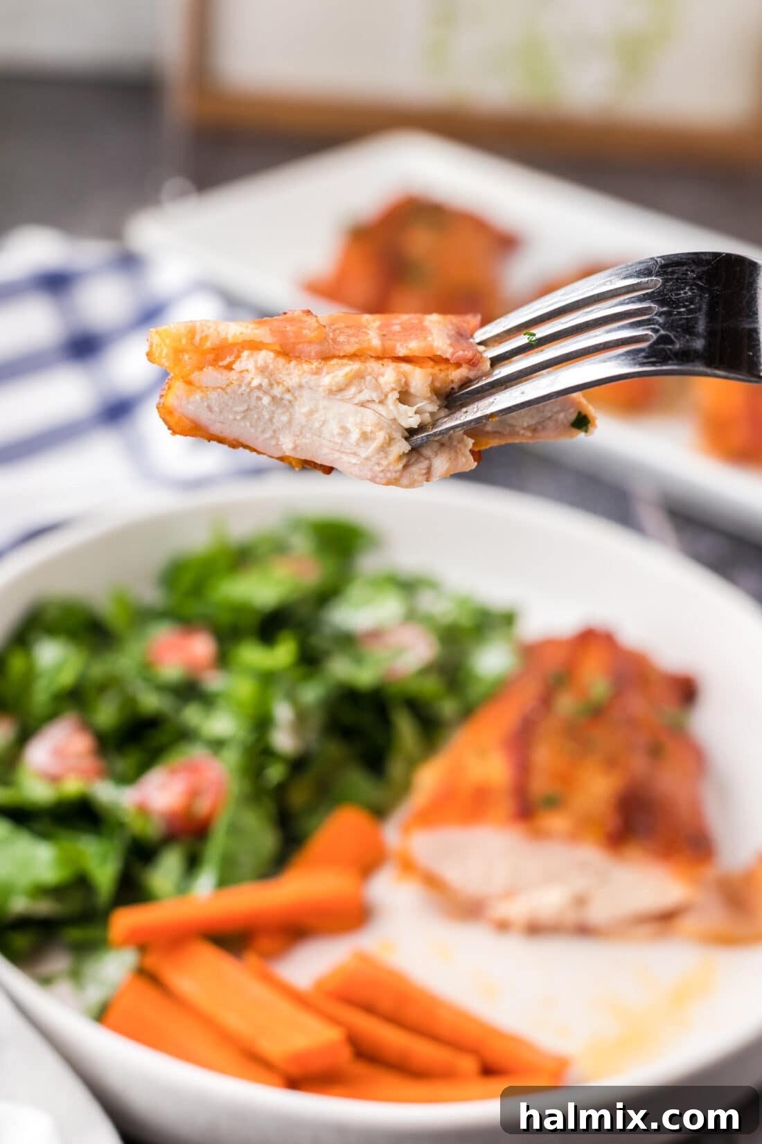 Crispy Bacon Chicken Bundles 11 Piece of Bacon Wrapped Chicken on a fork, ready to eat