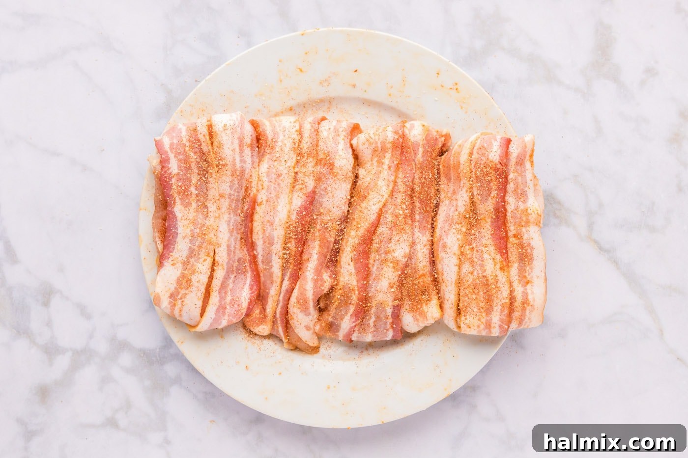 Crispy Bacon Chicken Bundles 8 bacon wrapped chicken breasts on a plate