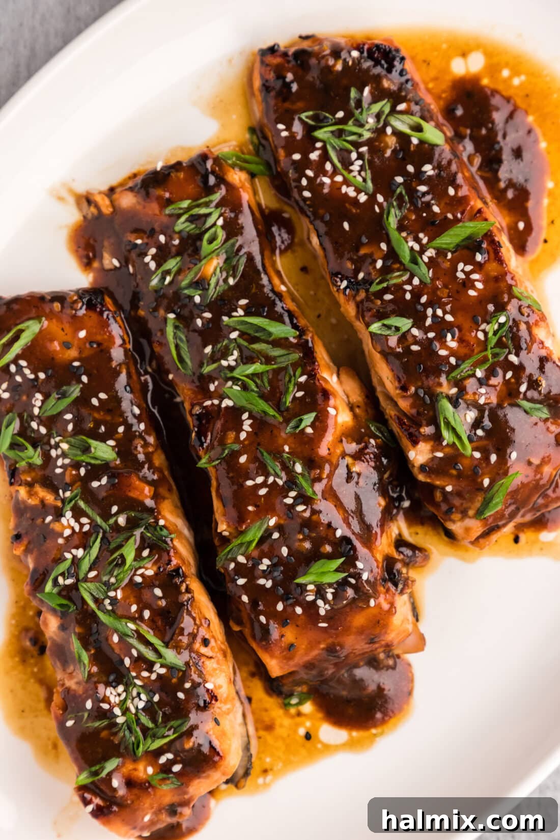 Platter of perfectly cooked teriyaki salmon fillets