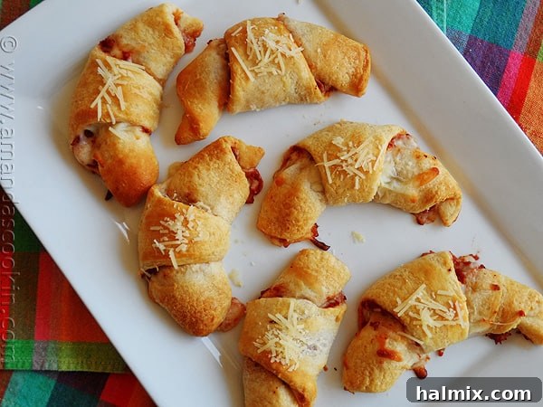 Cheesy Pizza Crescent Pinwheels 2 An overhead photo of pizza crescent roll ups on a white platter.