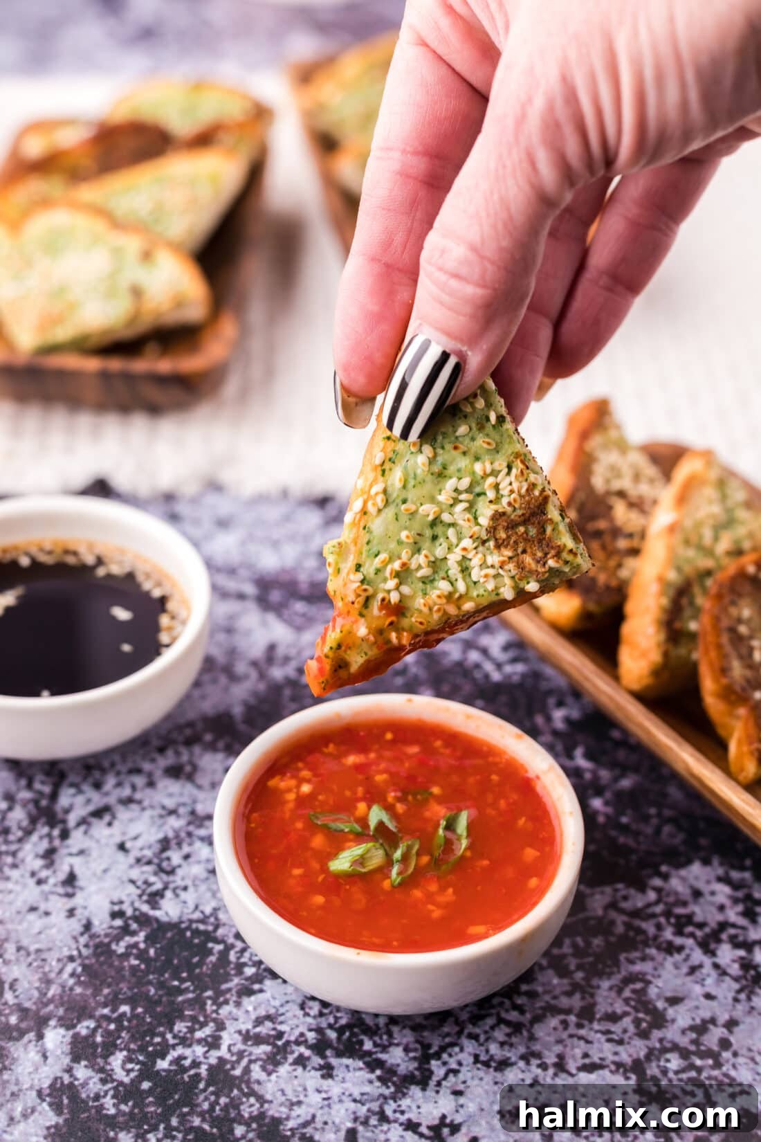 Crispy Golden Shrimp Toast 3 Shrimp Toast dipped in sweet chili sauce, highlighting its crispy texture