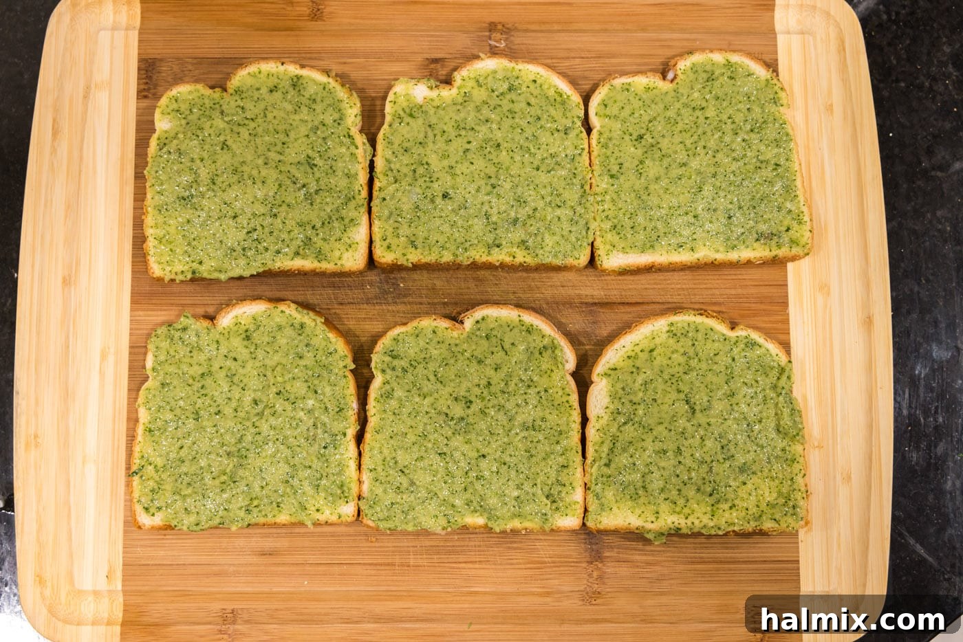 Crispy Golden Shrimp Toast 7 Applying shrimp toast paste evenly on top of a slice of white bread