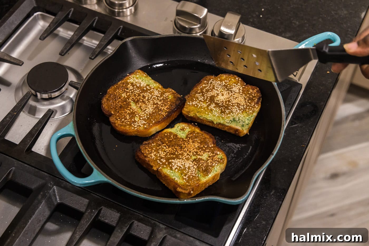 Crispy Golden Shrimp Toast 10 Shrimp toast cooking on the stovetop, showcasing the pan-frying process