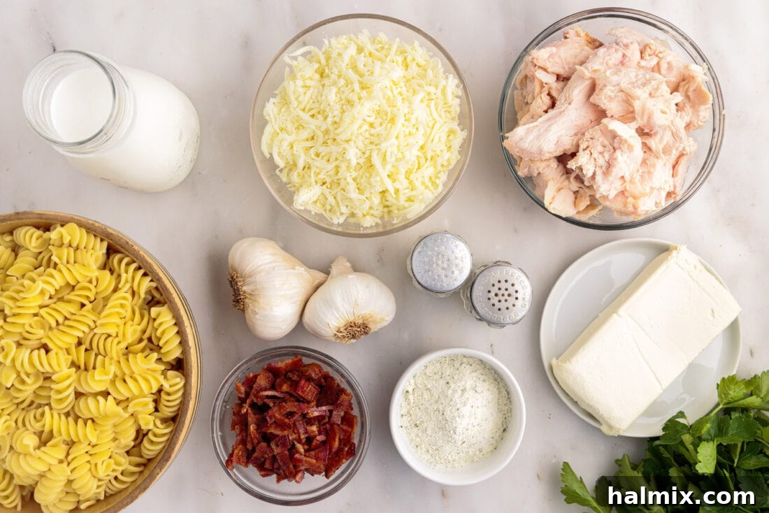 Ingredients for Chicken Bacon Ranch Casserole laid out on a table