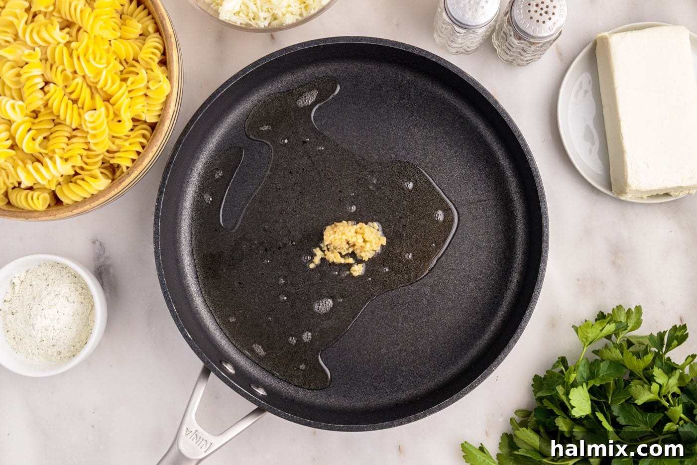 minced garlic sauteed in a skillet of oil