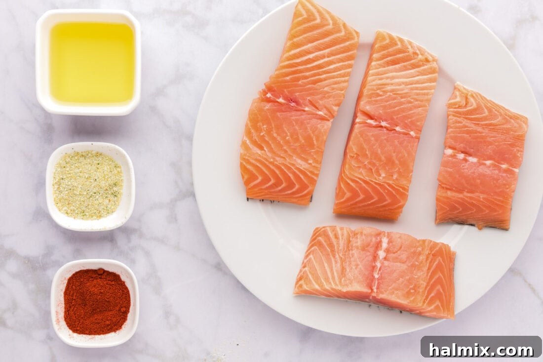 Succulent Roasted Salmon 4 A selection of ingredients for Roasted Salmon including salmon fillets, olive oil, garlic salt, and paprika