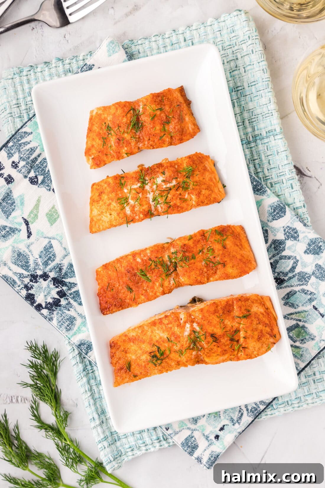 Succulent Roasted Salmon 9 A vibrant platter of perfectly Roasted Salmon fillets, garnished with fresh herbs and lemon wedges