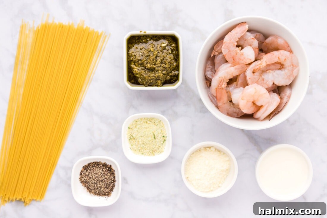 A vibrant display of fresh ingredients for Shrimp Pesto Pasta