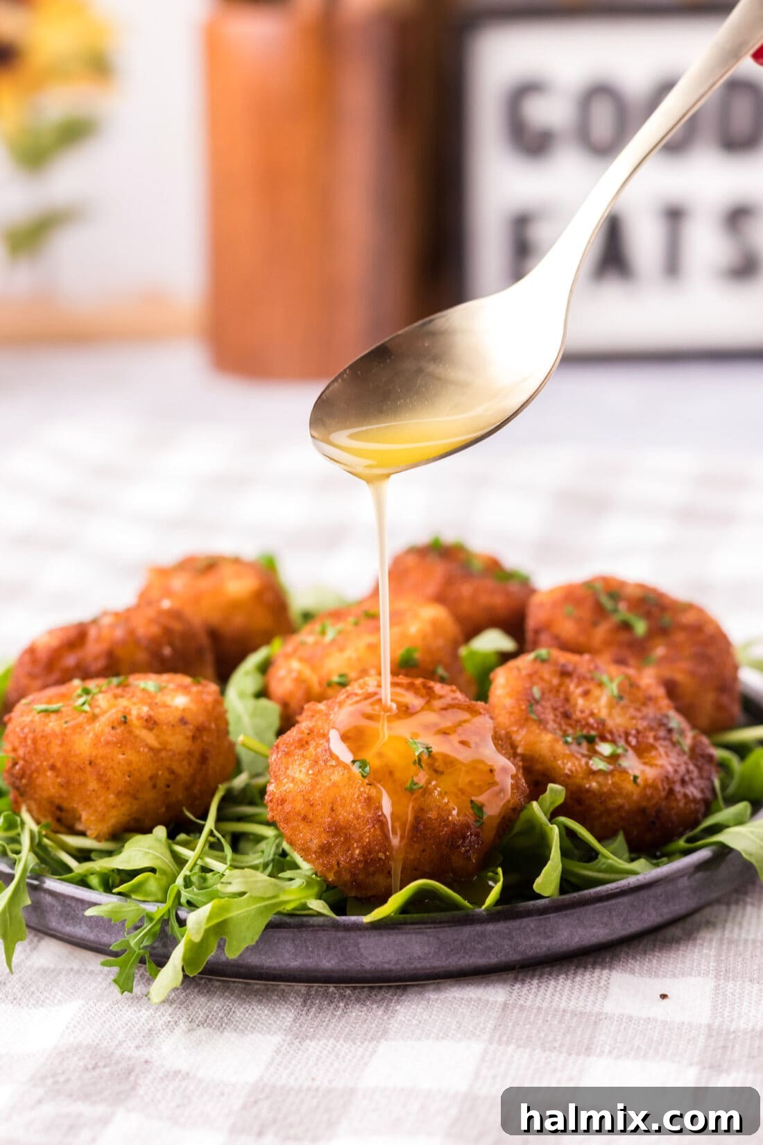 Golden Seared Scallops 2 Butter being drizzled from a spoon over Fried Scallops