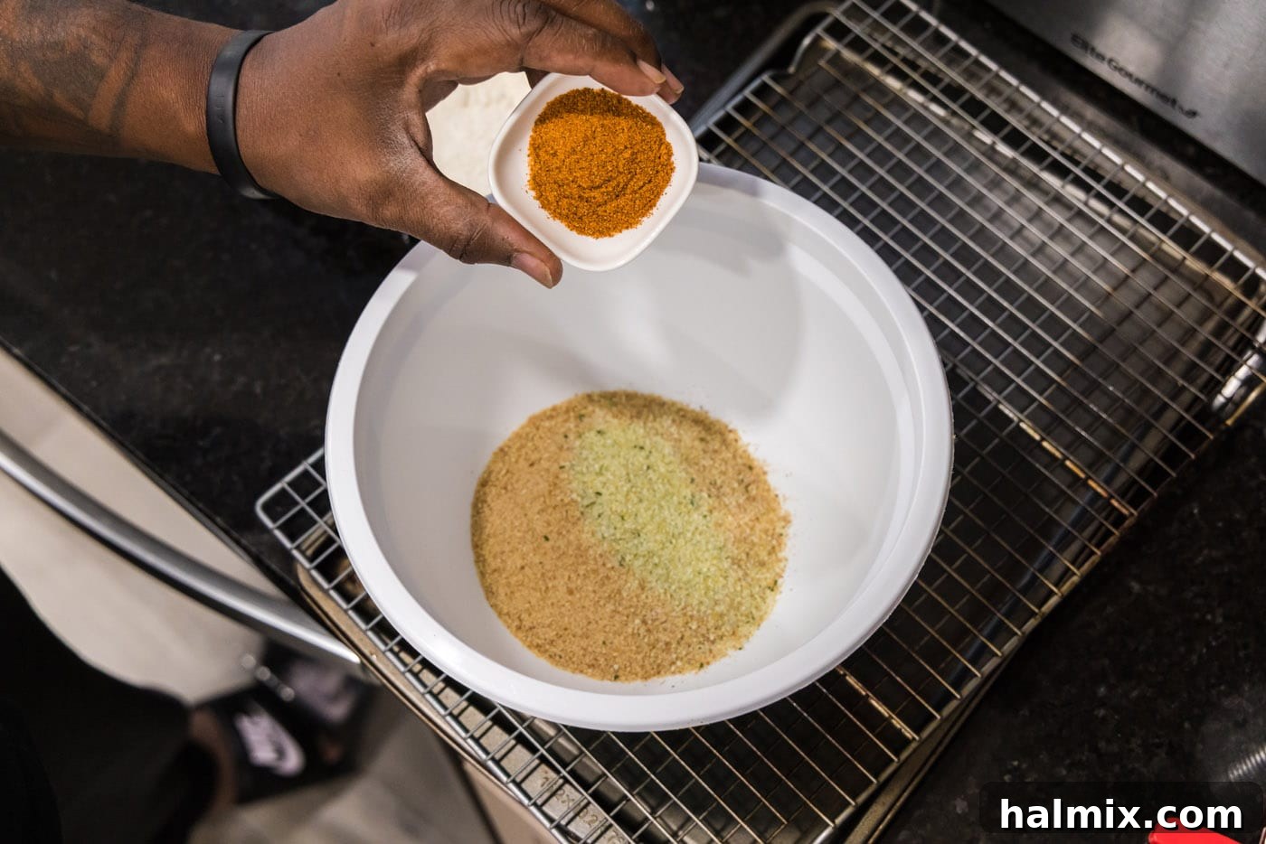 Golden Seared Scallops 5 breadcrumbs, garlic salt, and old bay seasoning in a mixing bowl