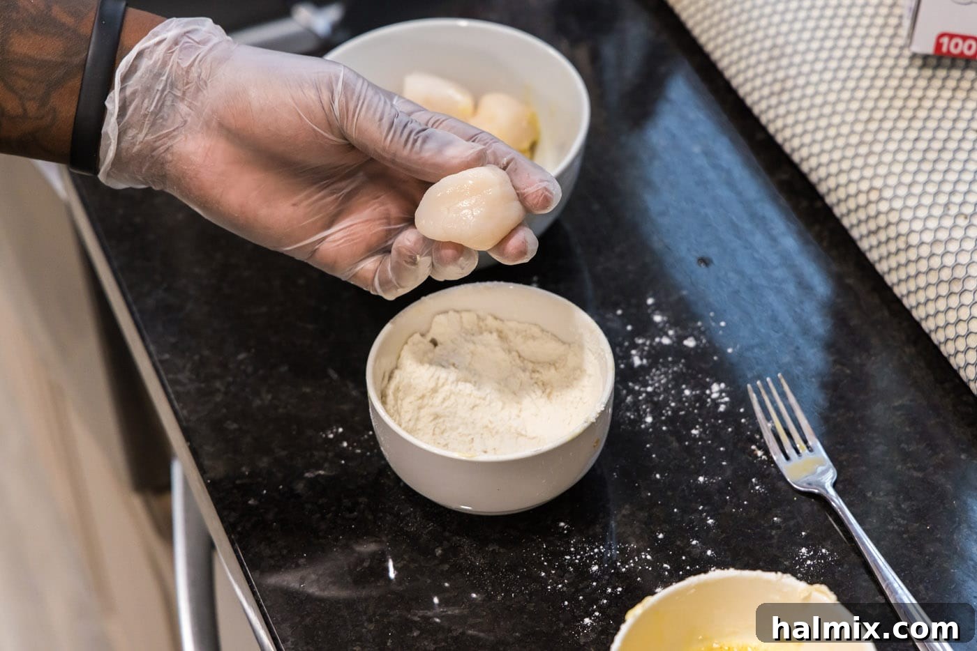 Golden Seared Scallops 7 dipping scallop into flour