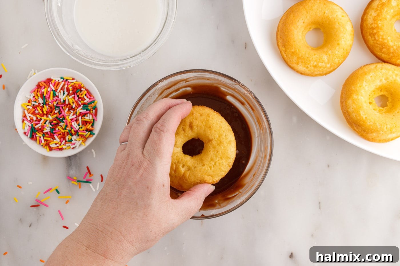 Easy Cake Mix Donuts 13 dipping donuts in chocolate glaze