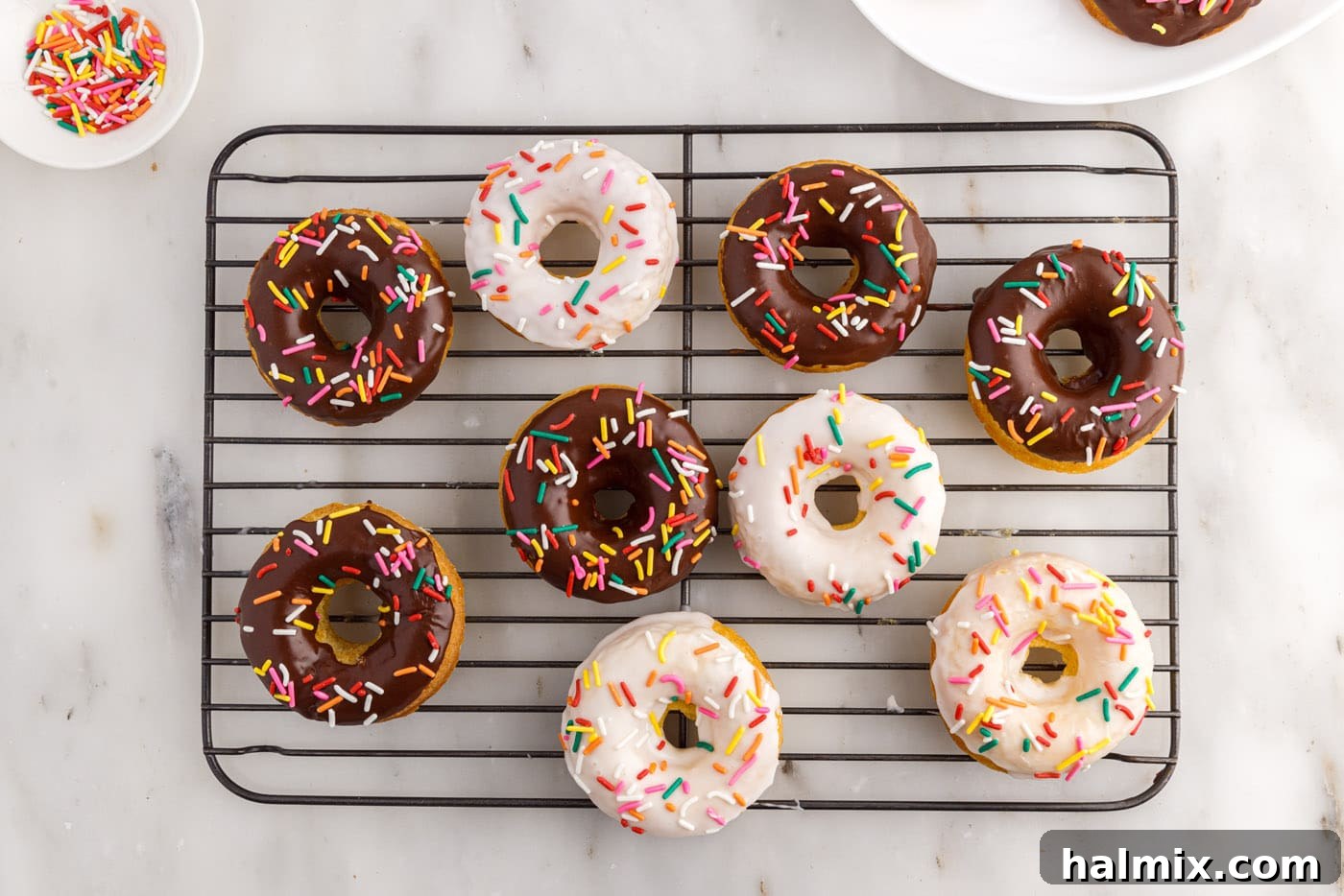 cake mix donuts with vanilla and chocolate glaze topped with sprinkles