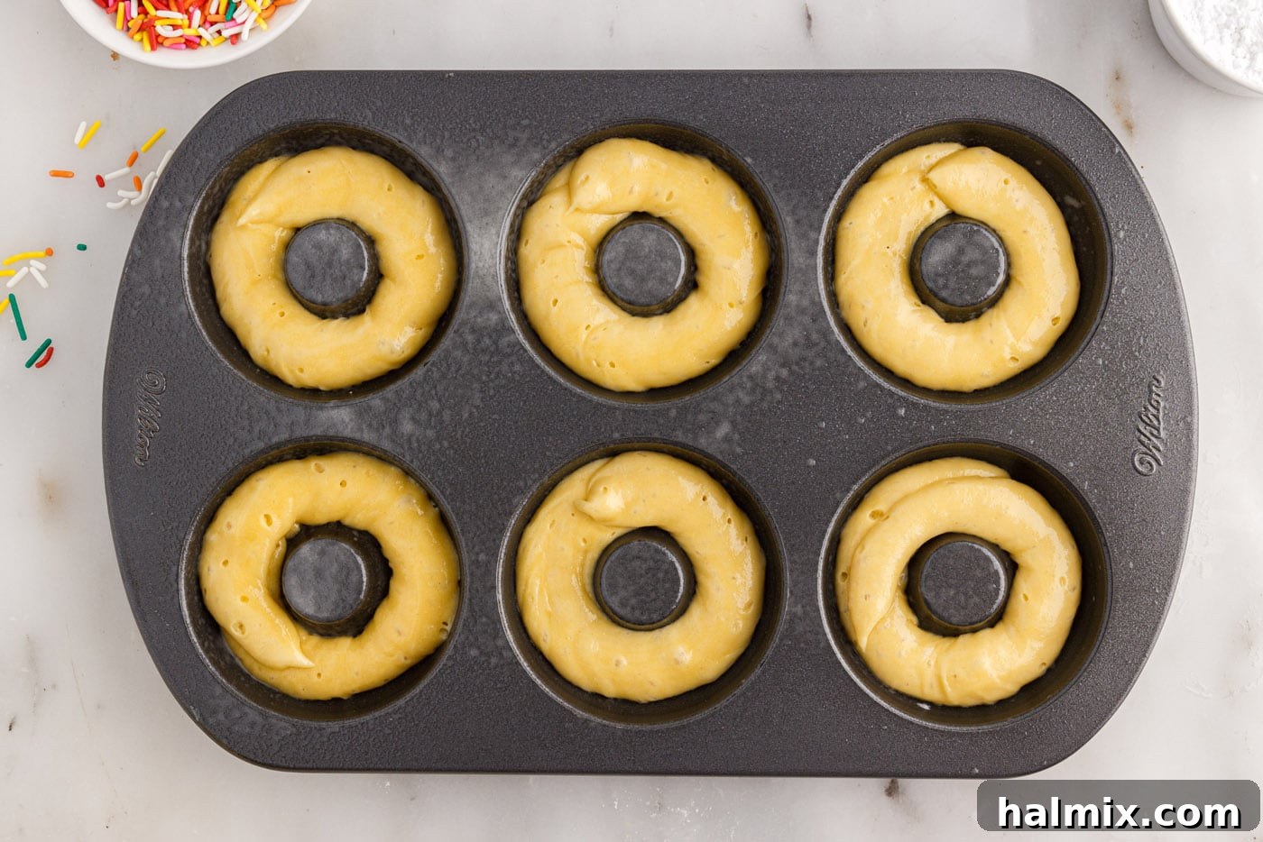 donut batter in a pan