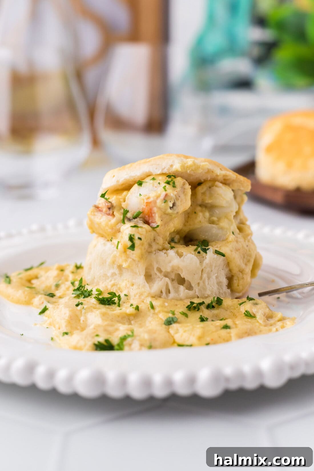 Lobster Newburg on an open biscuit