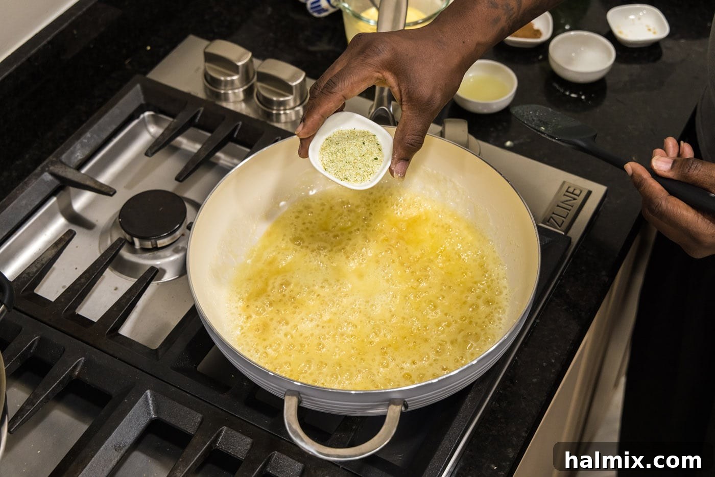 Adding garlic salt to skillet with butter mixture