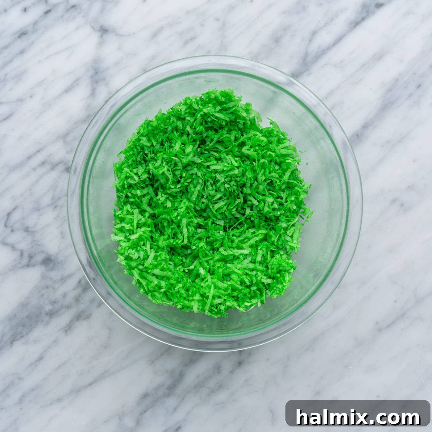 green tinted shredded coconut in a bowl
