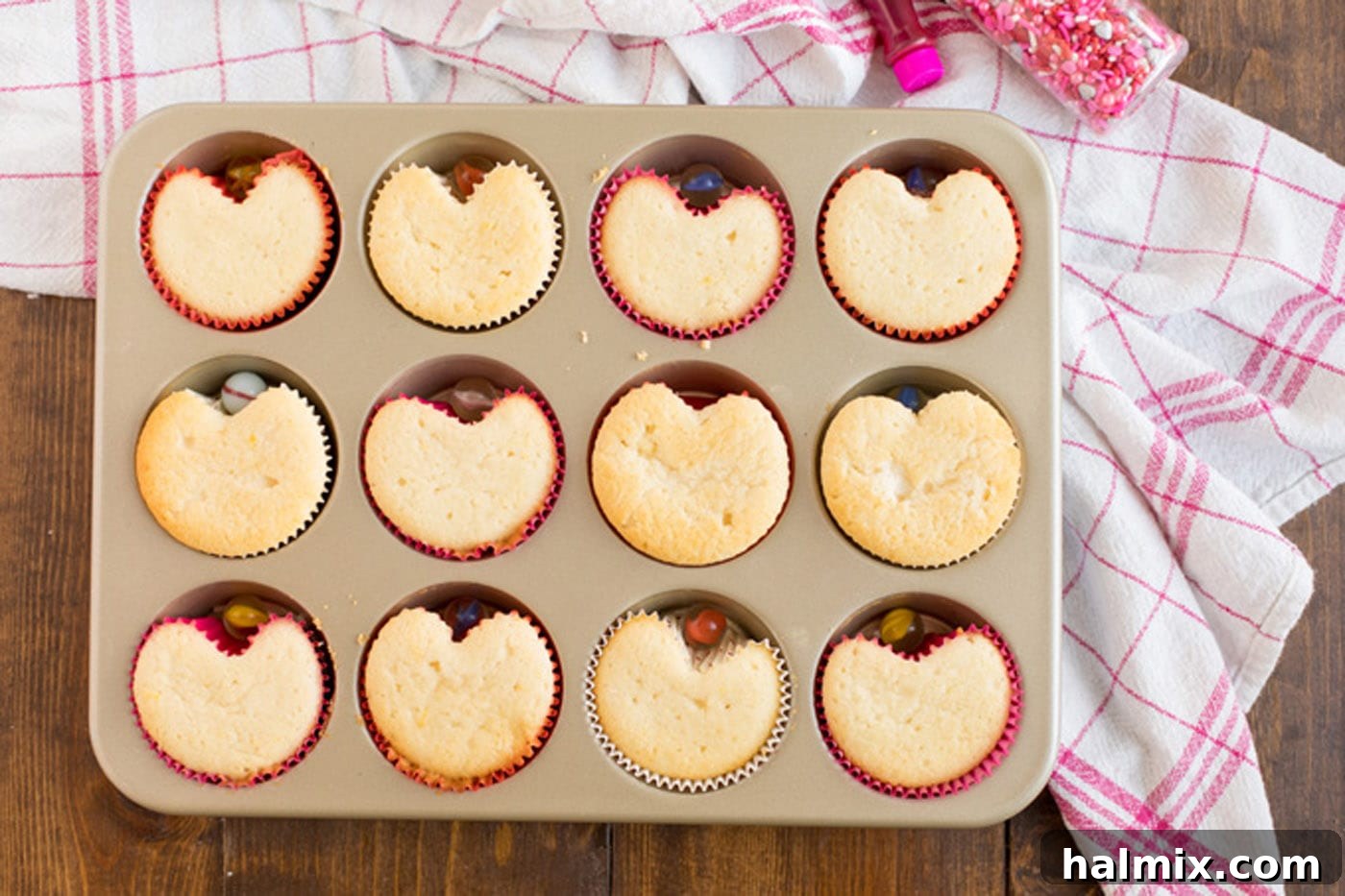 Baked Valentine Heart Cupcakes in a muffin pan, showing their heart shape.