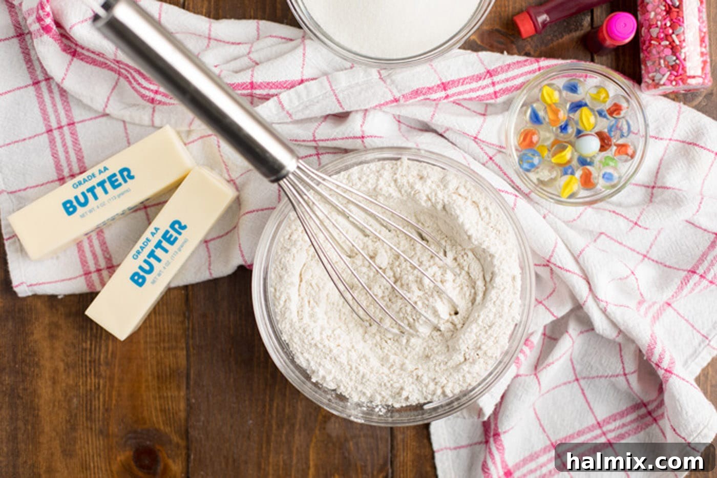 Cake flour, baking powder and salt in a bowl with a whisk