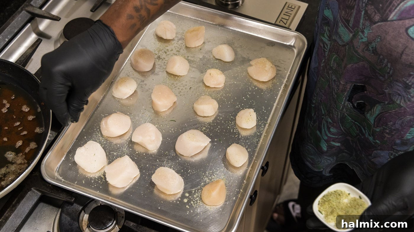 Lemon Garlic Baked Scallops 5 Scallops neatly arranged on a baking sheet, ready for seasoning.