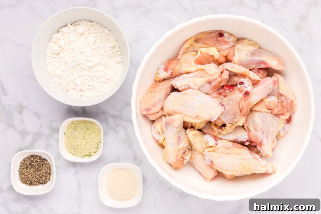 Ingredients laid out for Fried Chicken Wings preparation: chicken wings, flour, and seasonings.