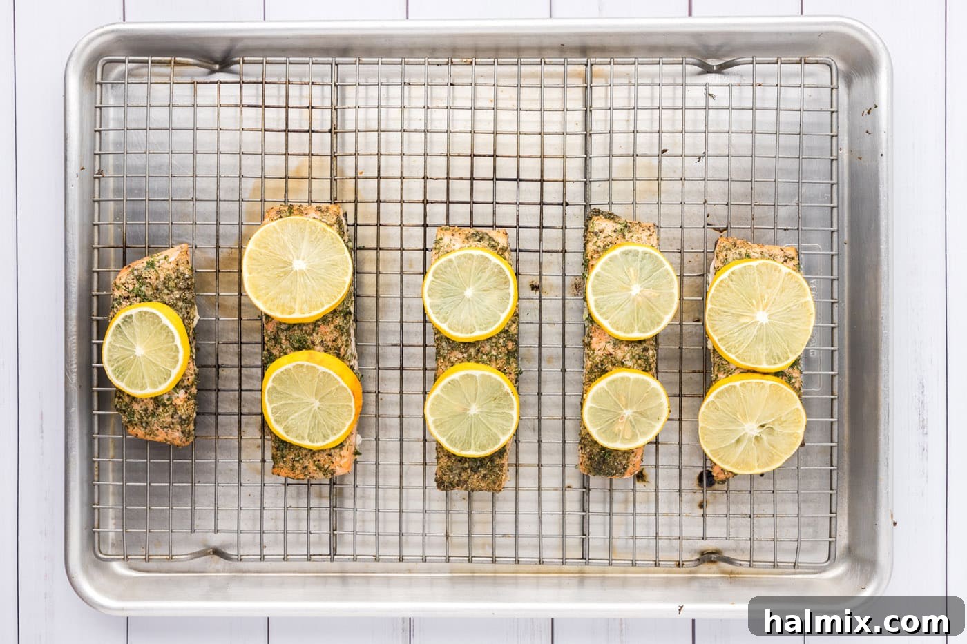 Smoked Salmon with Dill 10 Close-up of baked dill salmon with vibrant lemon slices and fresh dill, fresh out of the oven, perfectly cooked.