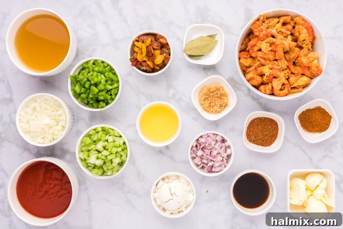 Fresh ingredients laid out for preparing Crawfish Etoufee: crawfish tails, vegetables, seasonings