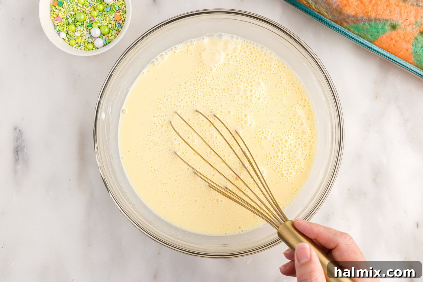 whisking instant vanilla pudding in a bowl