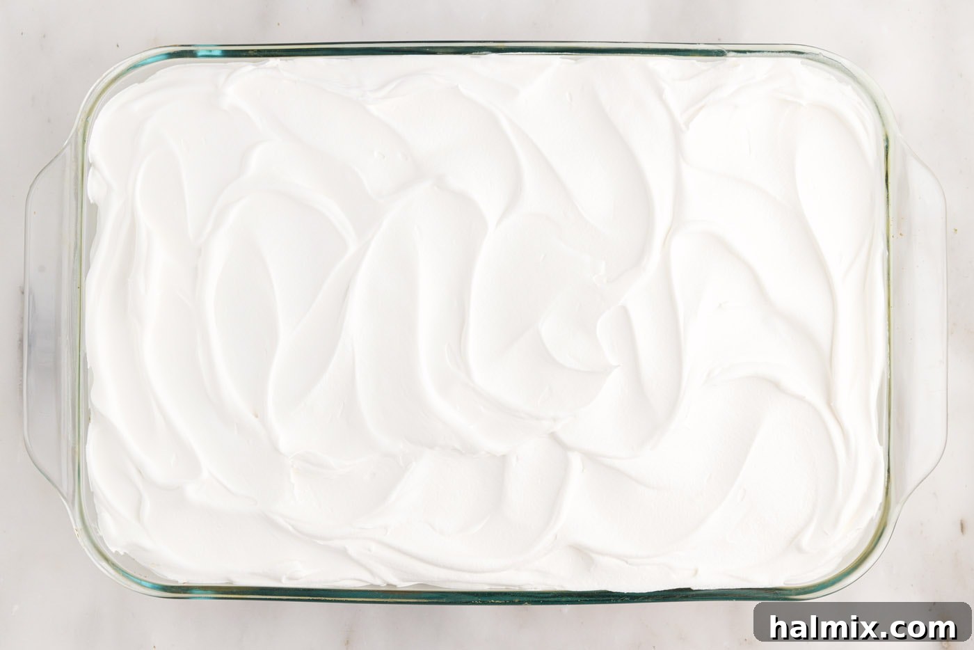 swirled cool whip on top of cake