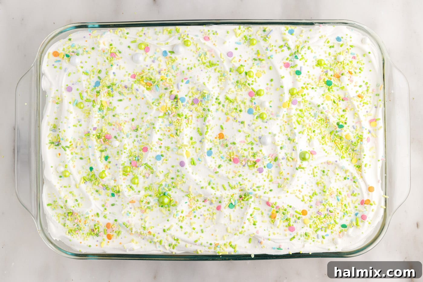easter poke cake with colorful sprinkles