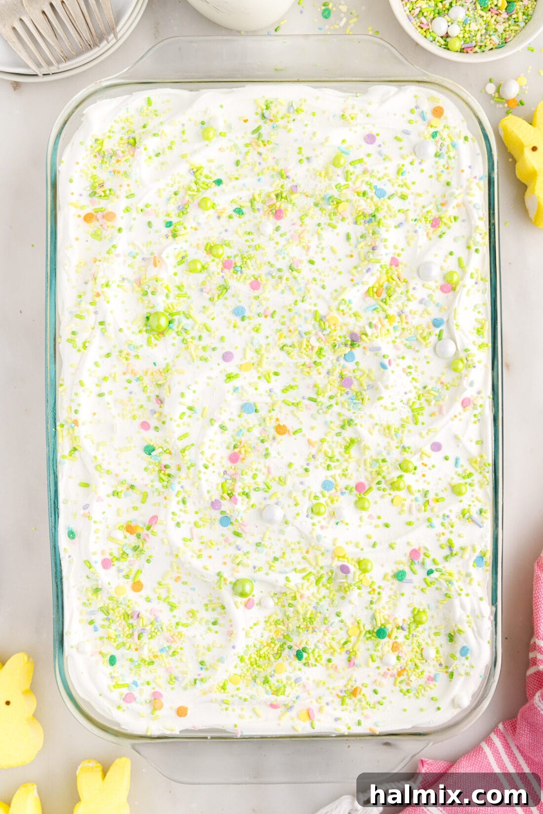 Easter Poke Cake in a 13x9 baking dish, untouched and beautifully decorated