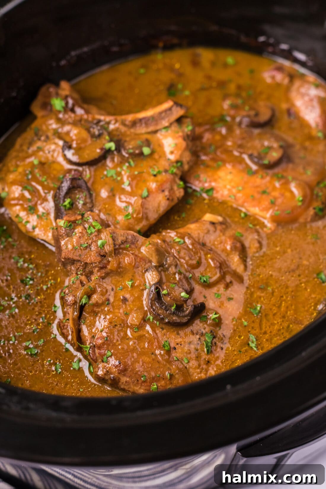 Close up photo of Crockpot Pork Chops in a crockpot