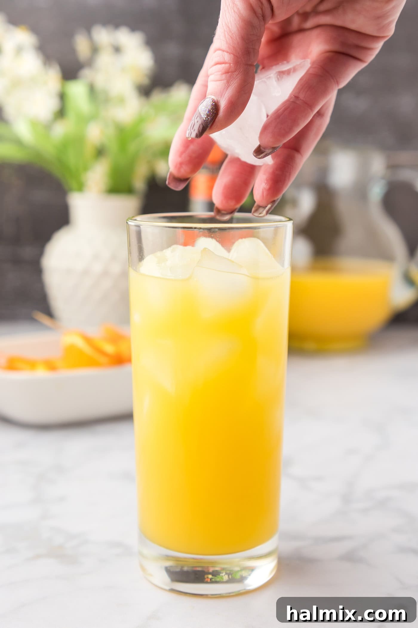 Velvet Peach Sunset 8 Adding more ice to Fuzzy Navel cocktail