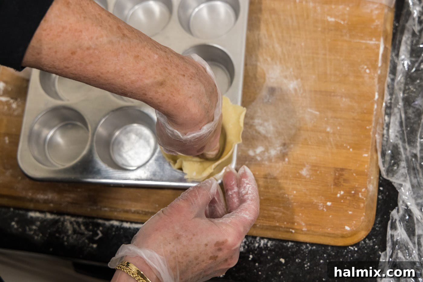 Decadent Mini French Silk Treats 14 hand pressing dough ball into muffin cavity